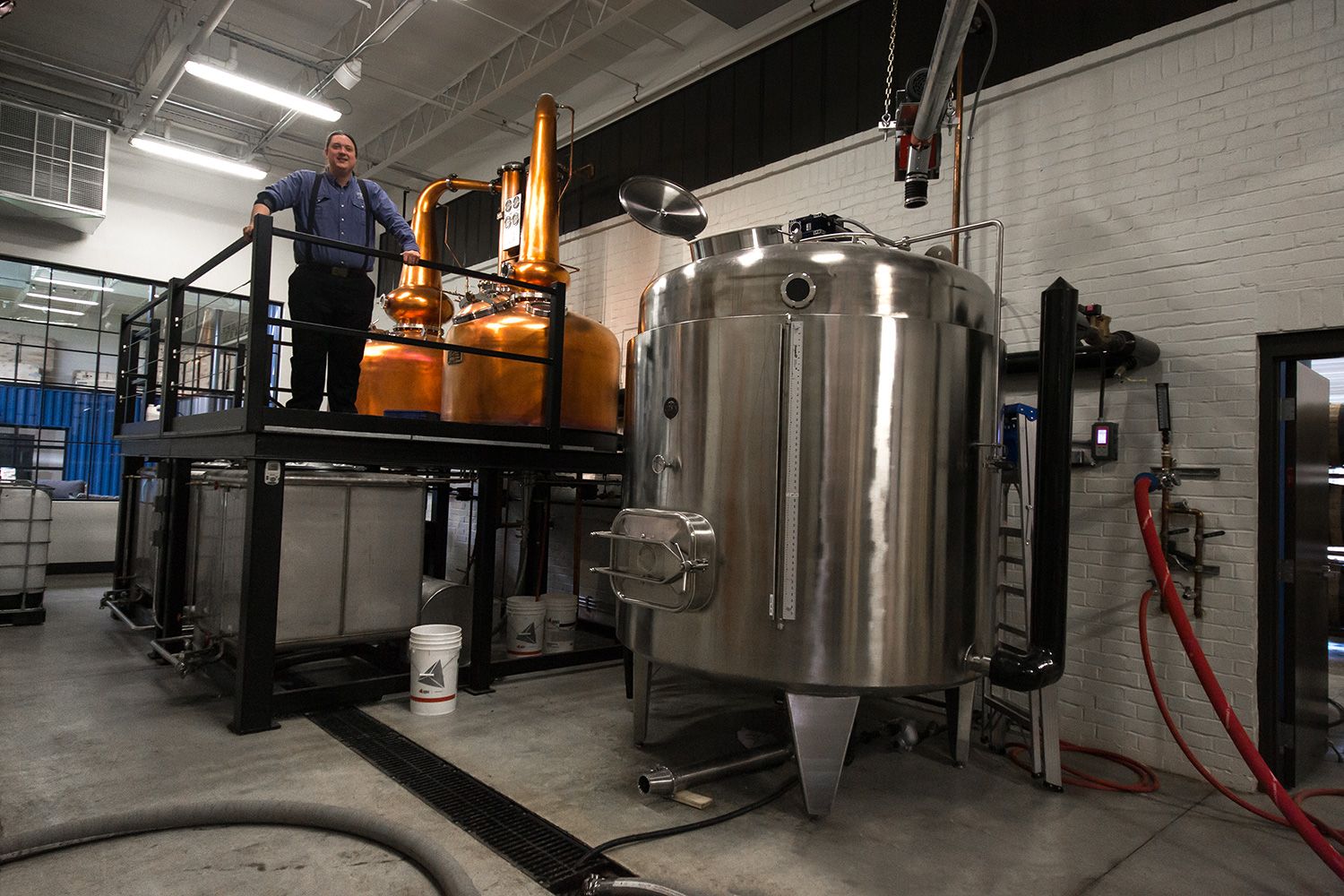 Employee Justin posing from the distiller's perch at ASW.