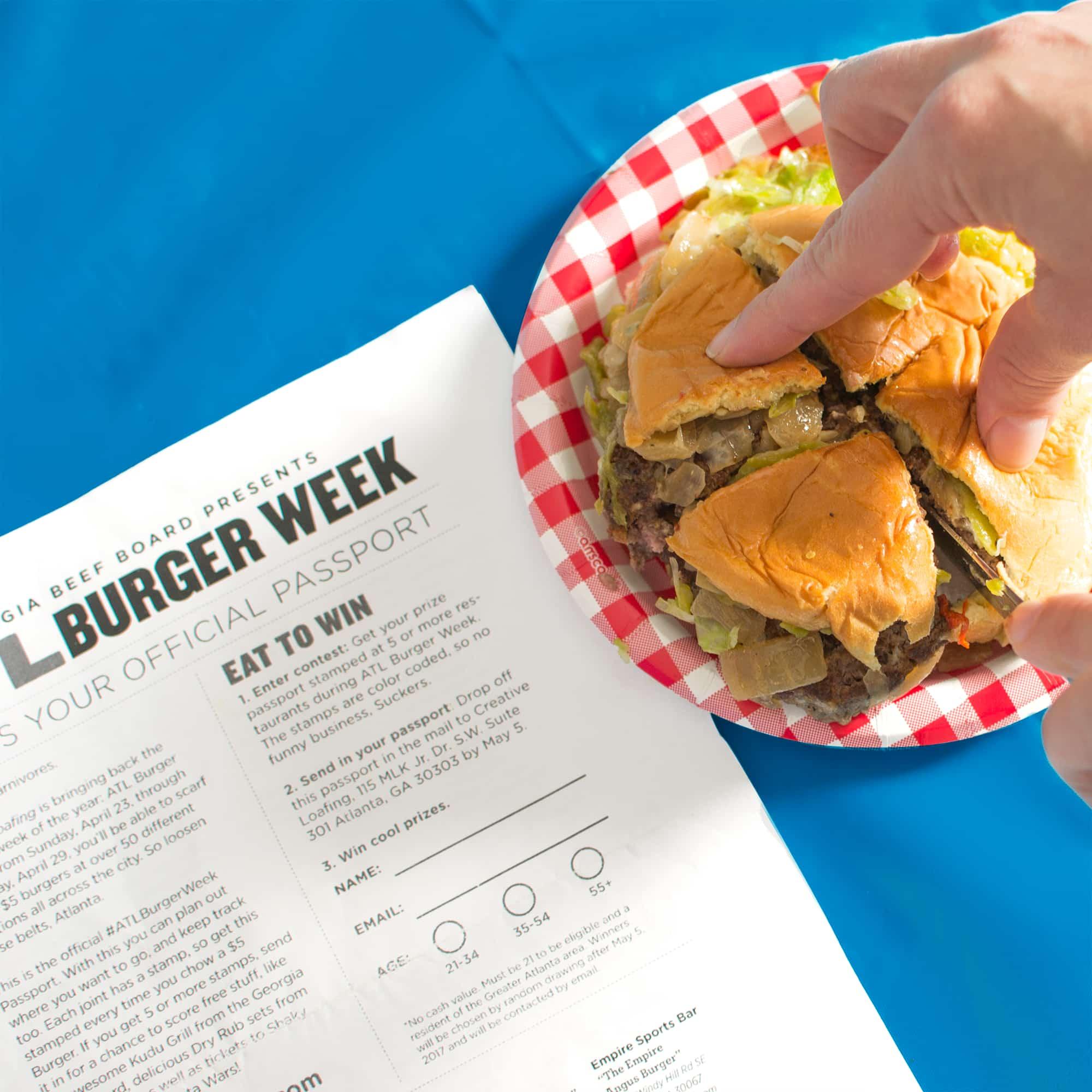 Displaying the Atlanta Burger Week official passport.