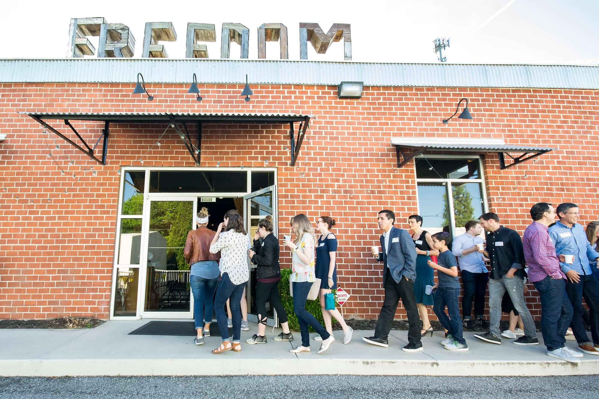 A view of event attendees lining up to enter the event.