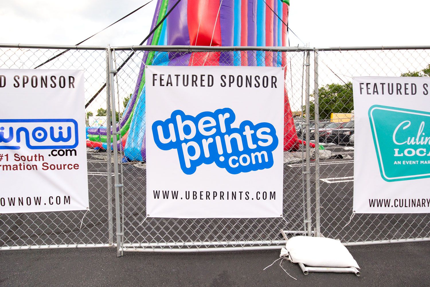 The UberPrints featured sponsor poster outside the International Night Market event.