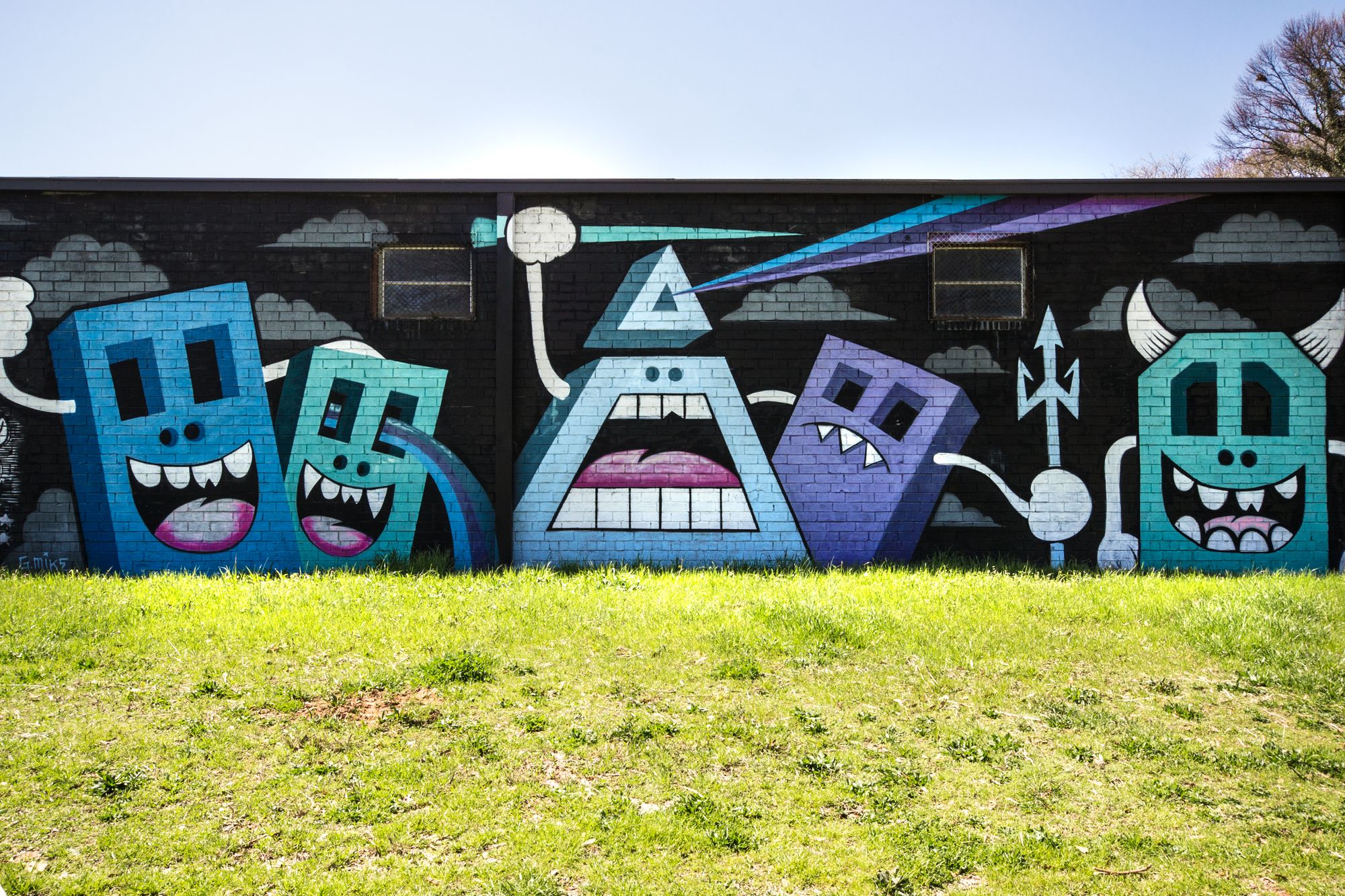 A mural by Greg Mike in his trademark style.