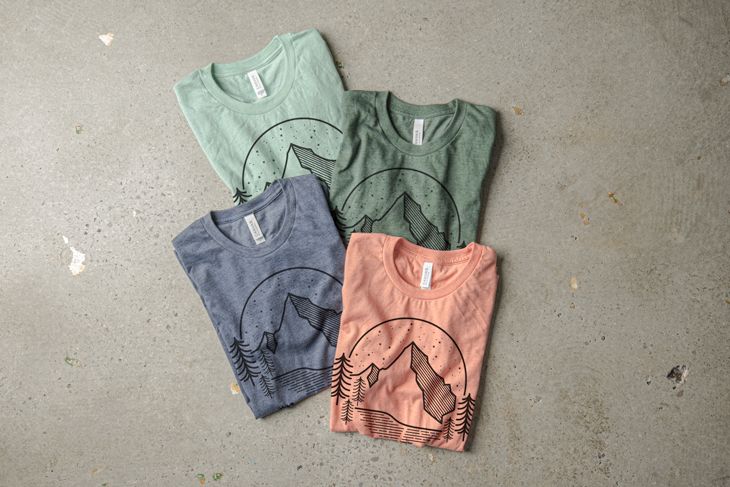 Four t-shirt colors representing the color pallet folded into a display.