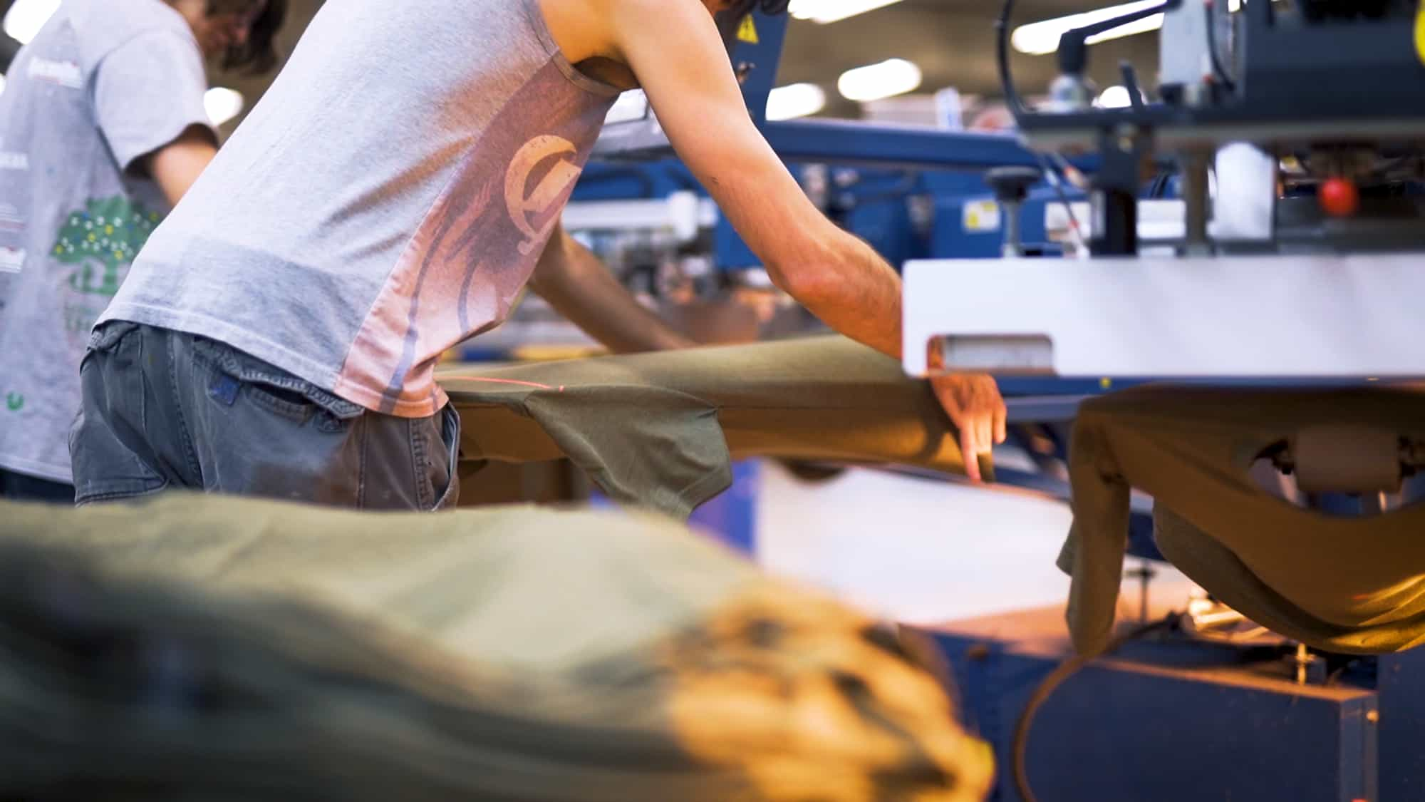 Operators screen printing a t-shirt order.