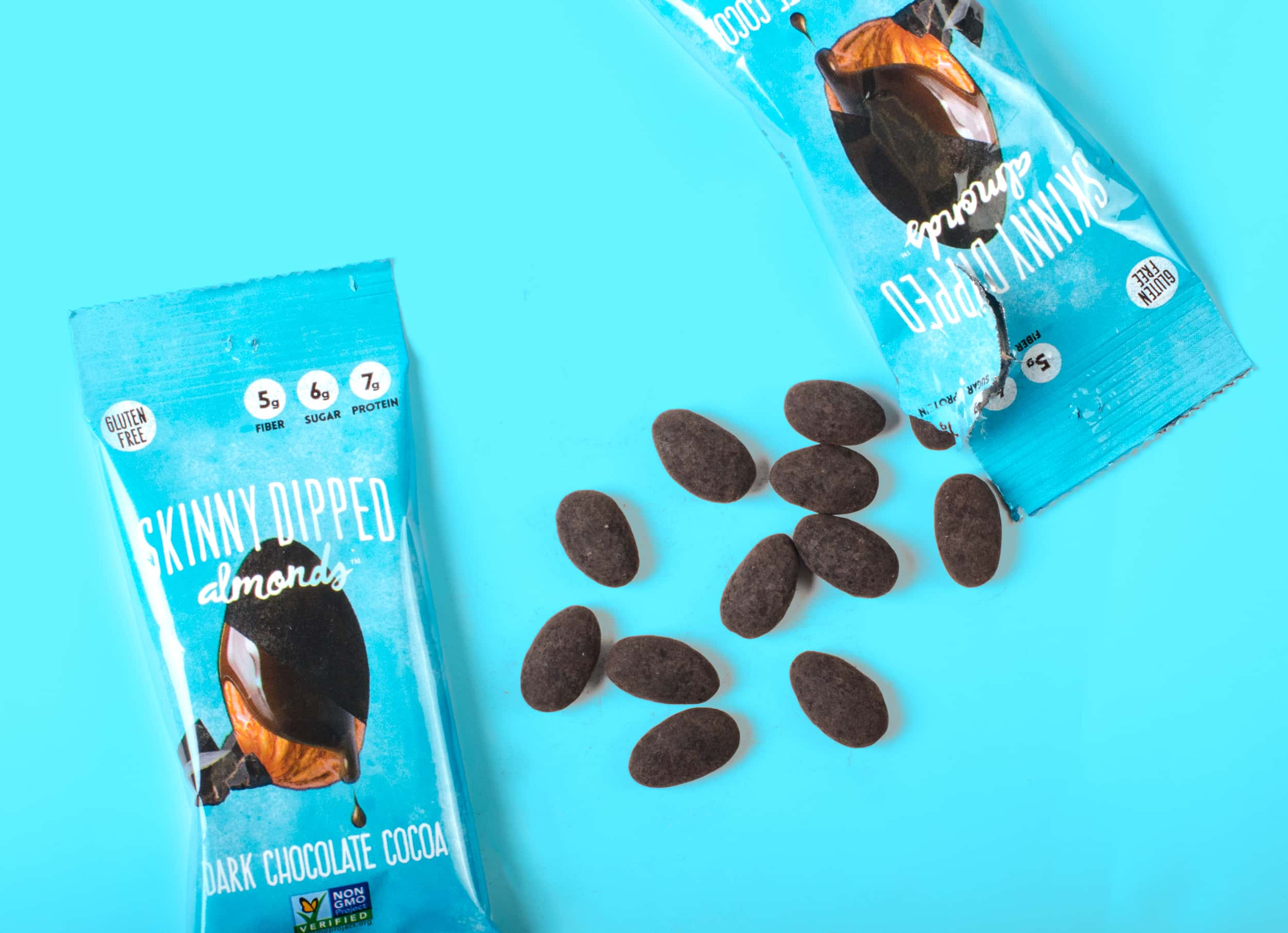 Skinny Dipped brand almonds and their packaging.