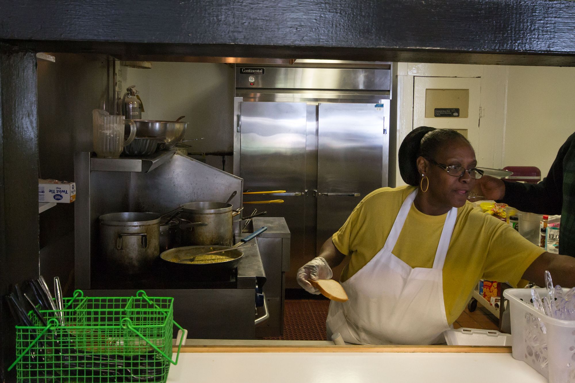 Weaver D's employee preparing food.