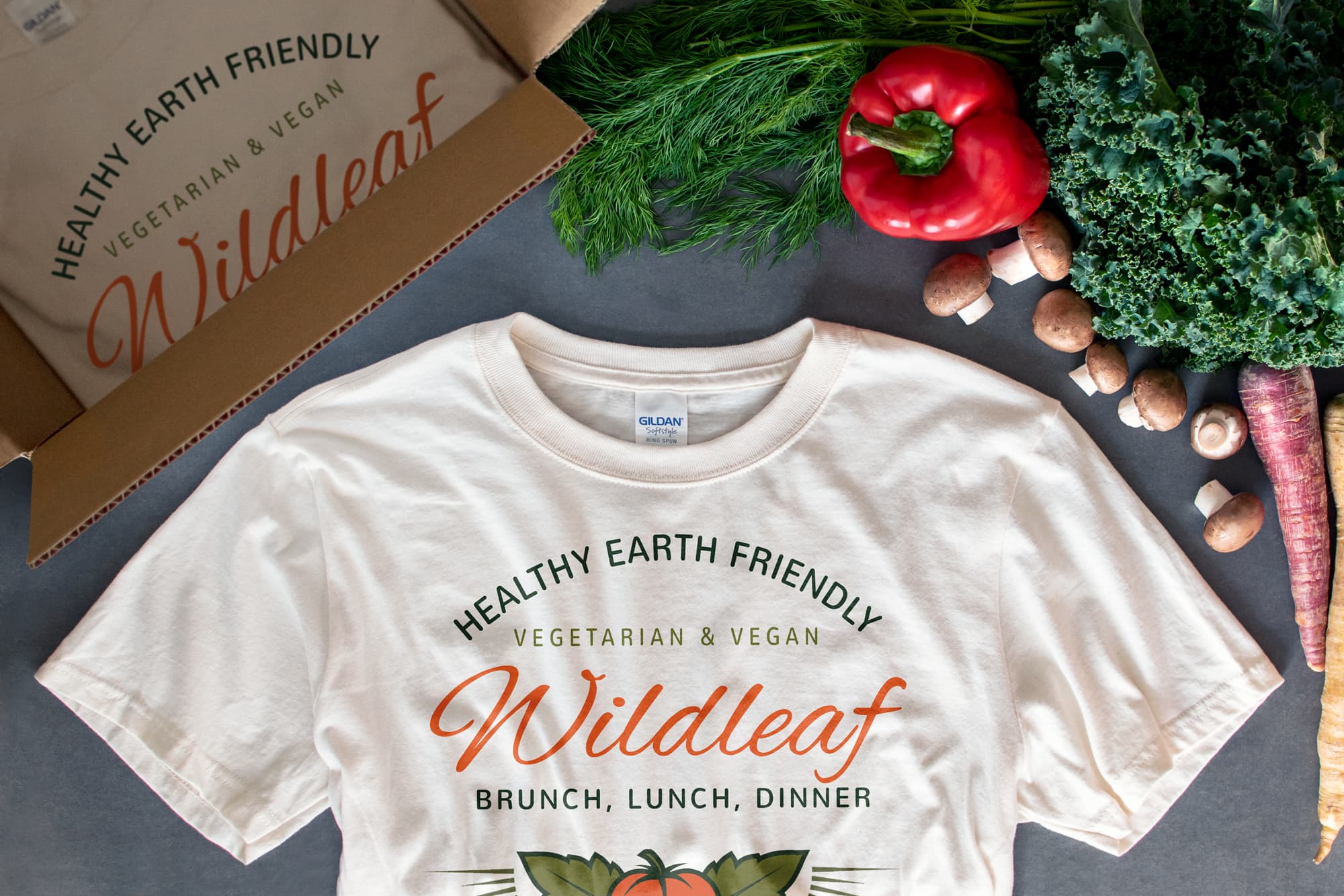 Flatlay showing restaurant receiving custom t-shirts.