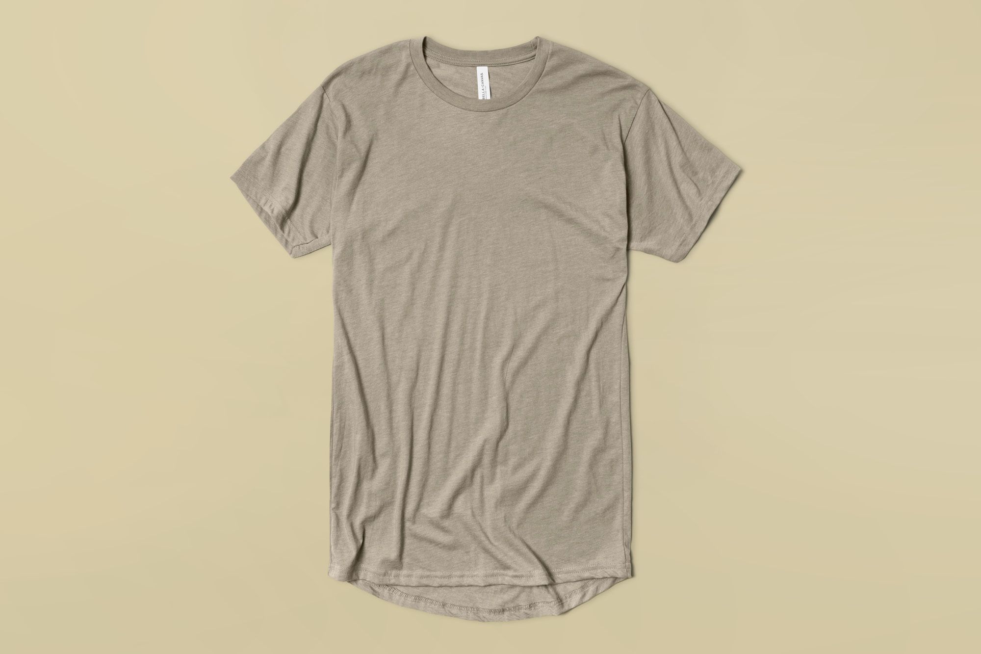 Flatlay showing t-shirt with curved hem bottom.