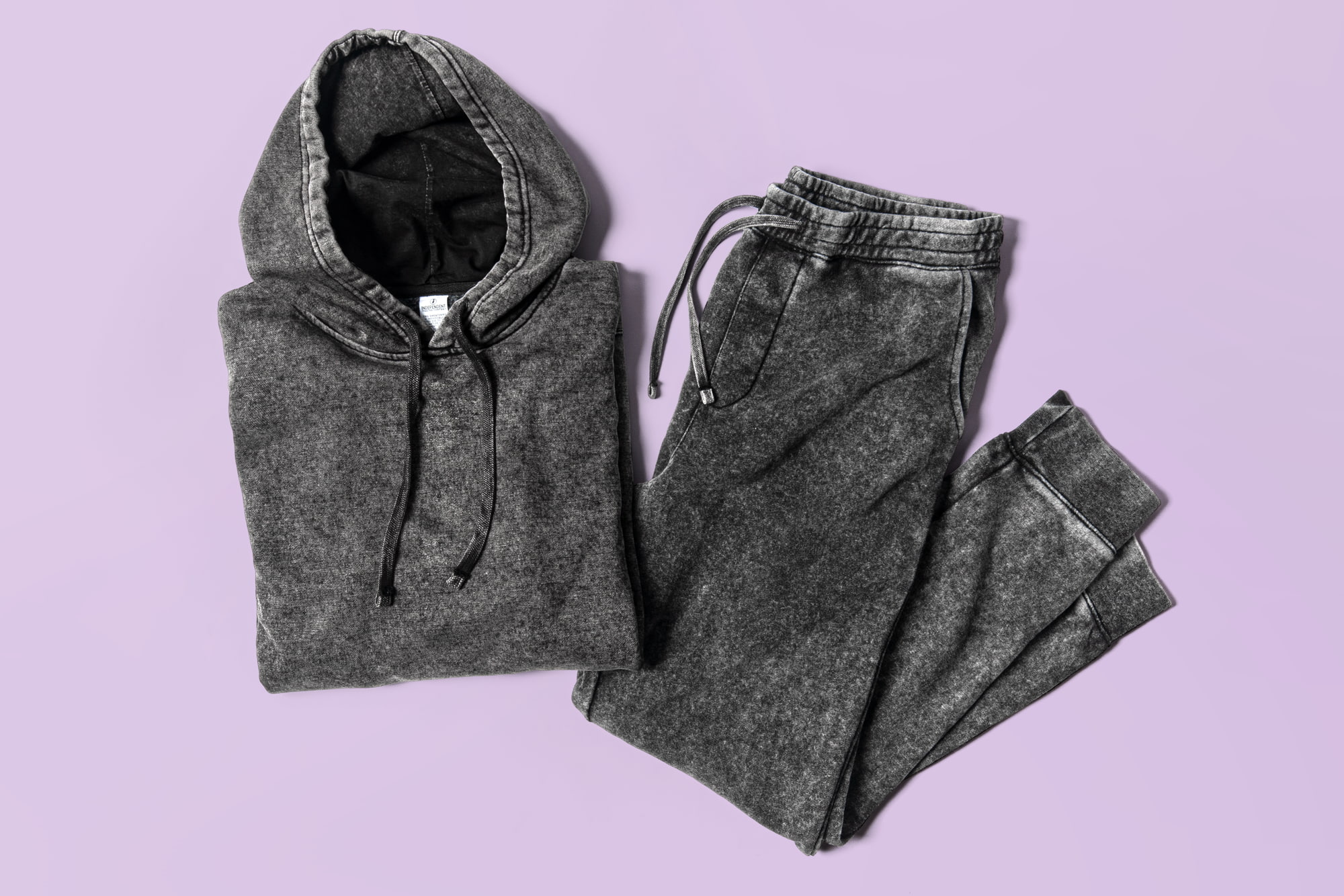 Flatlay image of mineral wash sweatpants and hoodie.