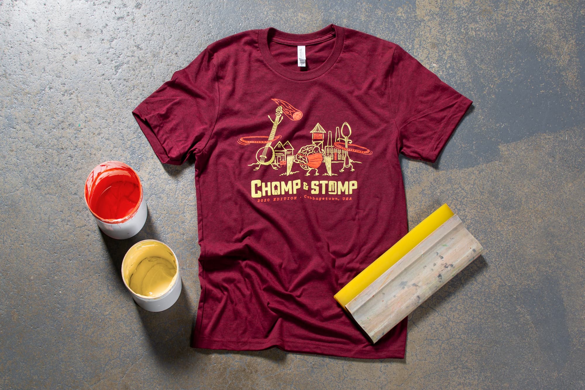 Flatlay image of Chomp and Stomp t-shirt.