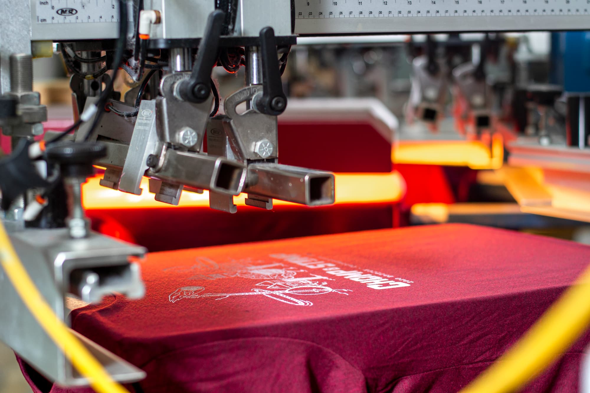 Another look behind the scenes at the Chomp and Stomp t-shirts being printed.