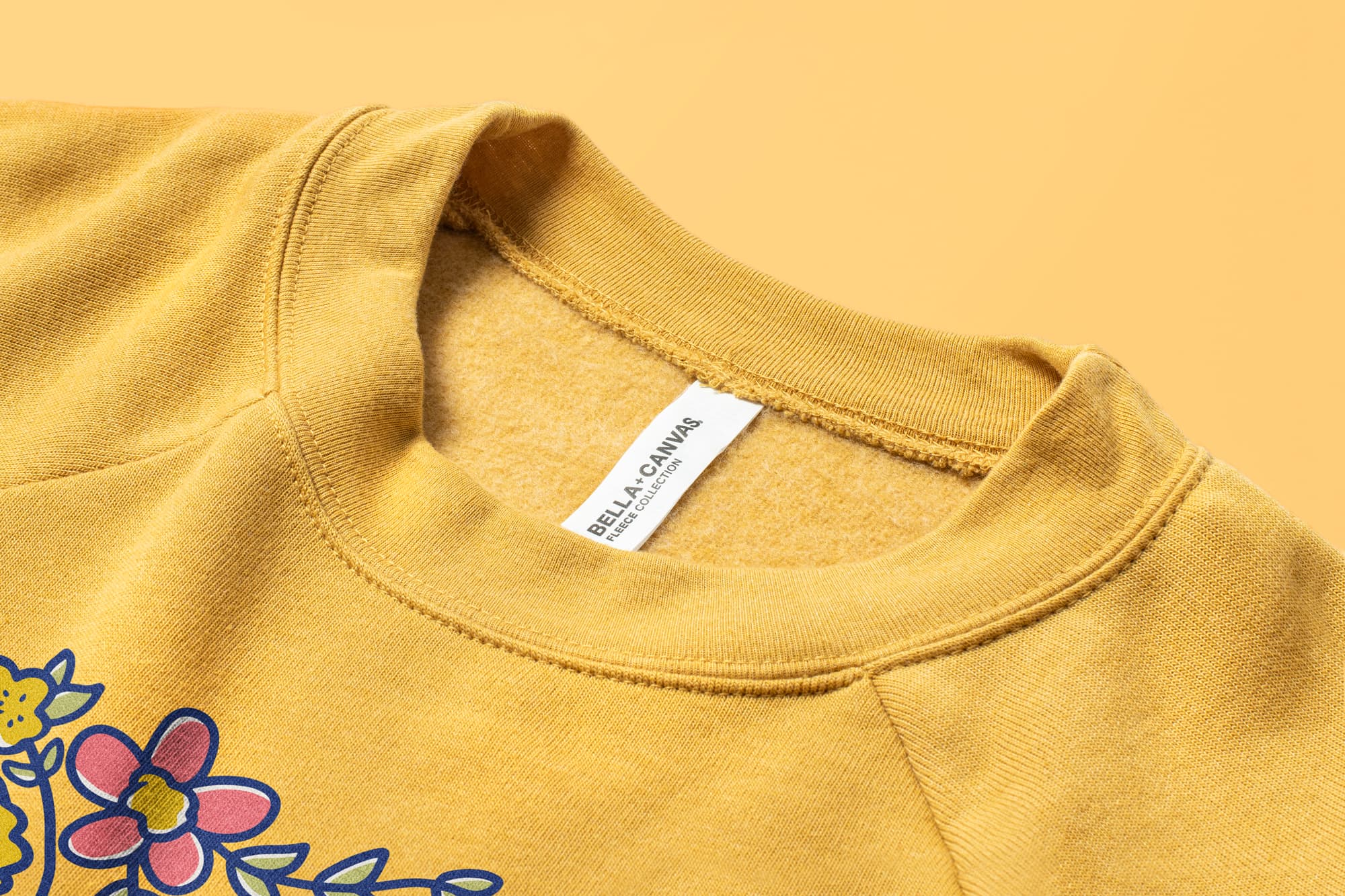 Detail of the collar of the Bella Canvas Ladies Raglan Cropped Fleece.