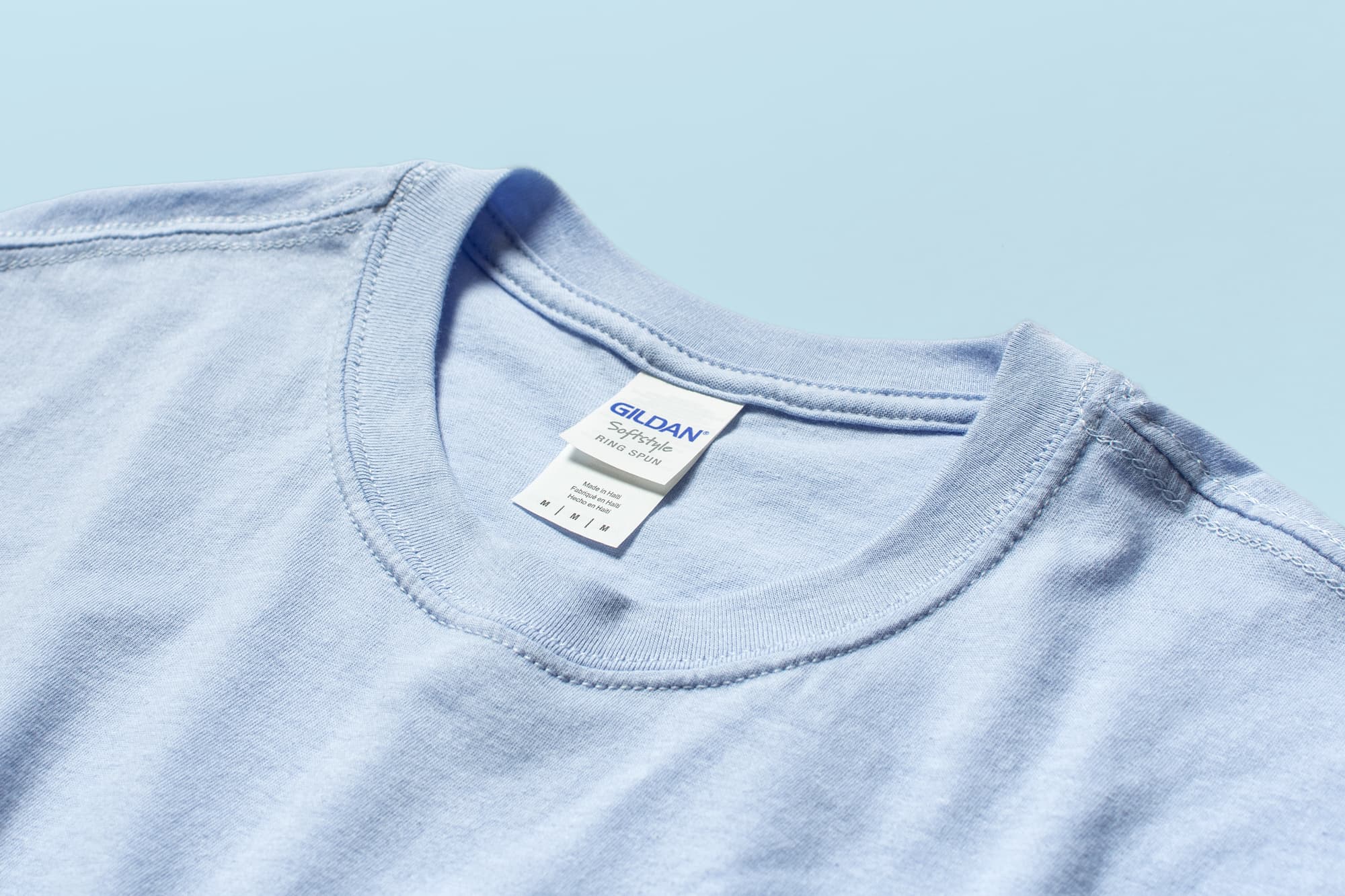 Detail of the collar and tag of the Gildan Softstyle T-Shirt.