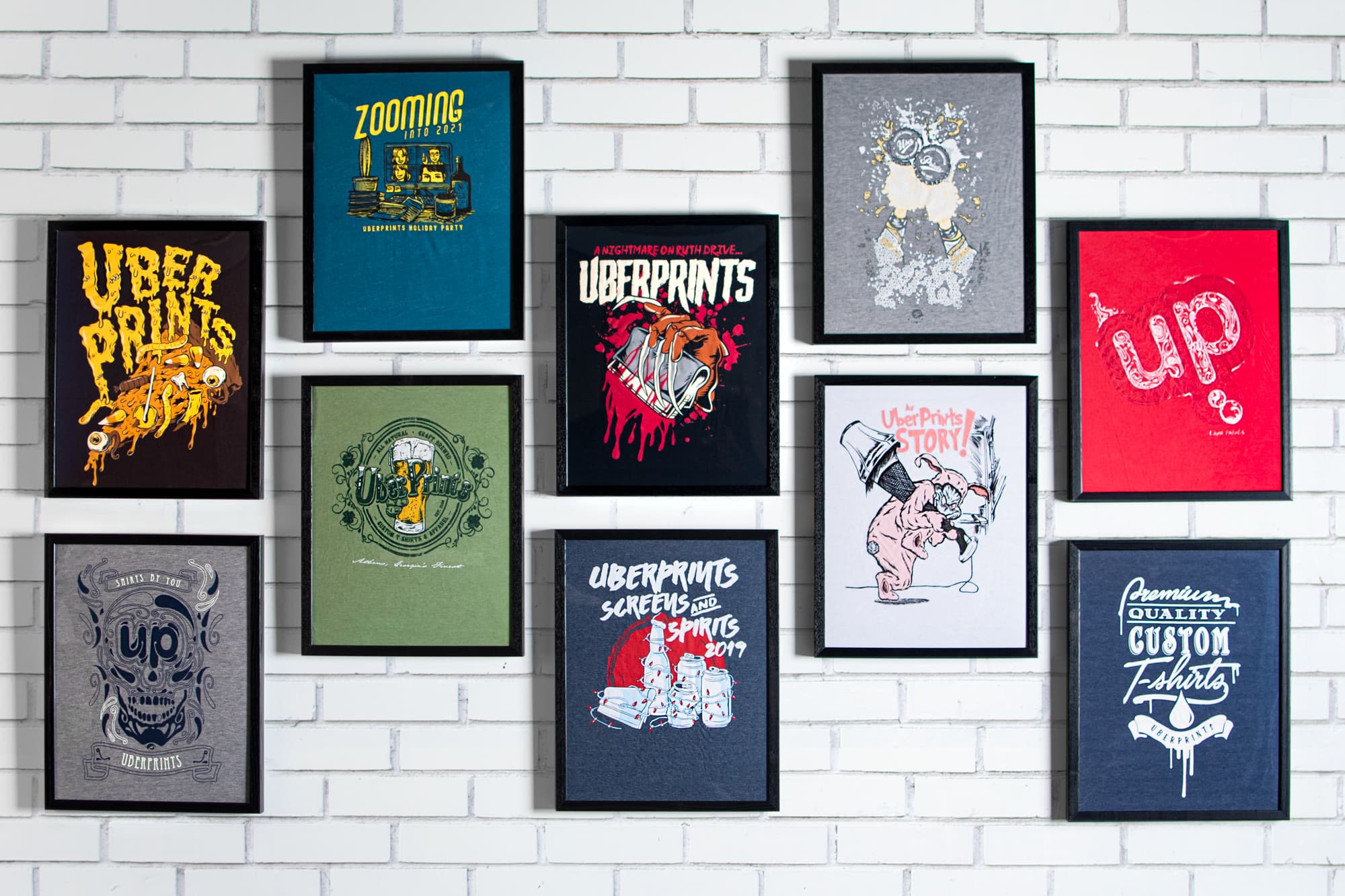 Pictured is our t-shirt wall. Previous years' t-shirt designs are framed and added to the wall. This is the wall before the Halloween addition.