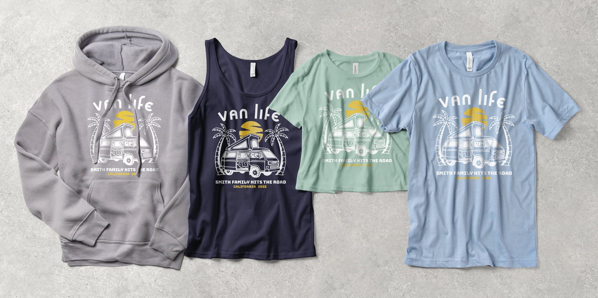 A variety of Bella Canvas product styles laying flat side by side on cement with a custom family vacation design. Products from left to right include a hoodie, tank top, crop top tee and t-shirt.
