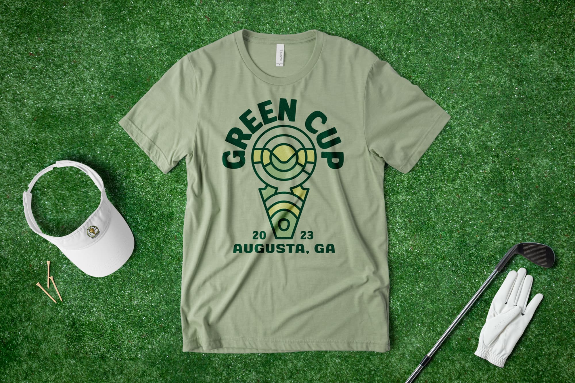 Flatlay on grass of a custom golf t-shirt with an abstract design
