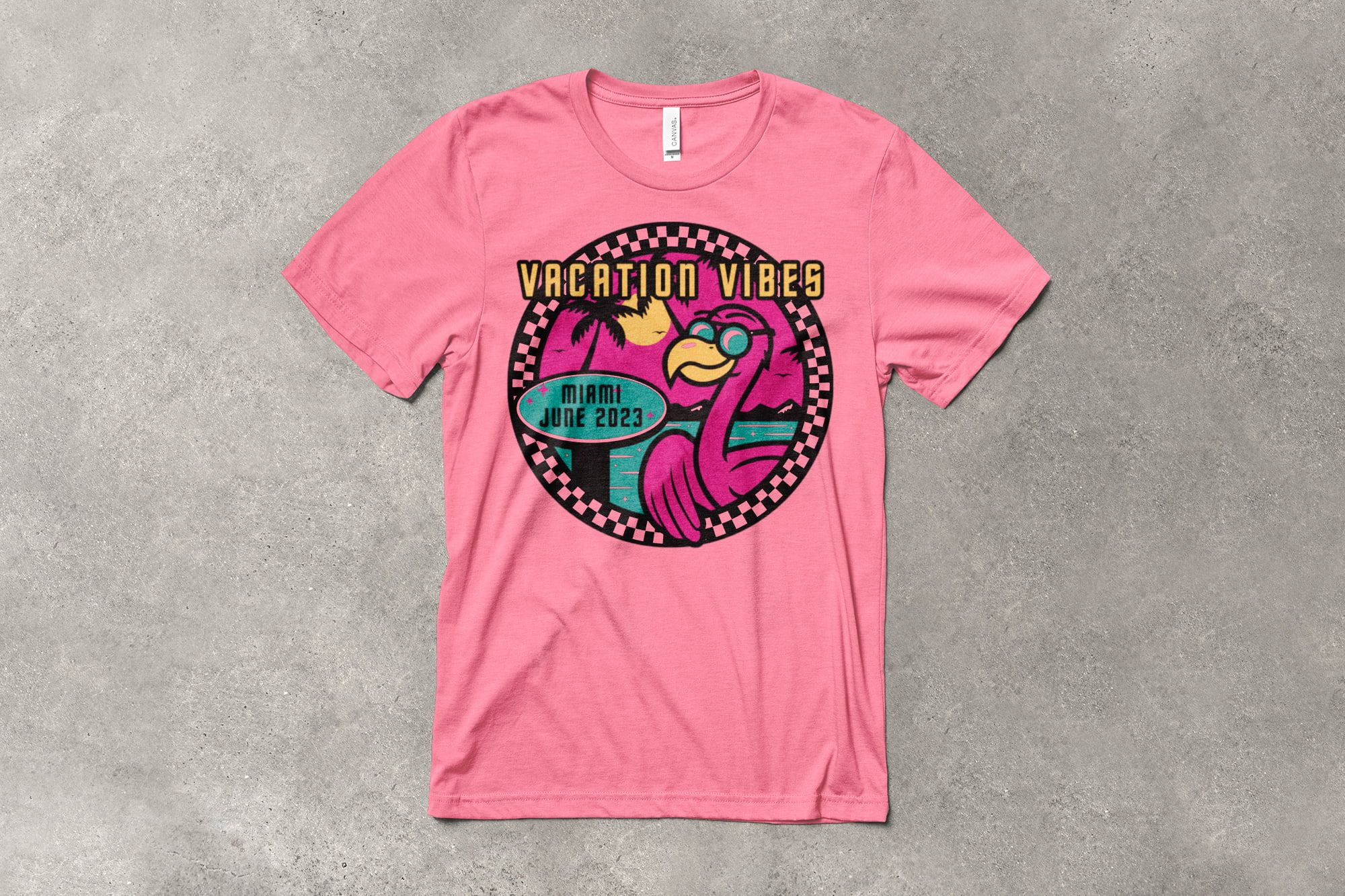 A bubblegum pink shirt with a playful vacation t-shirt design that features a bright magenta flamingo