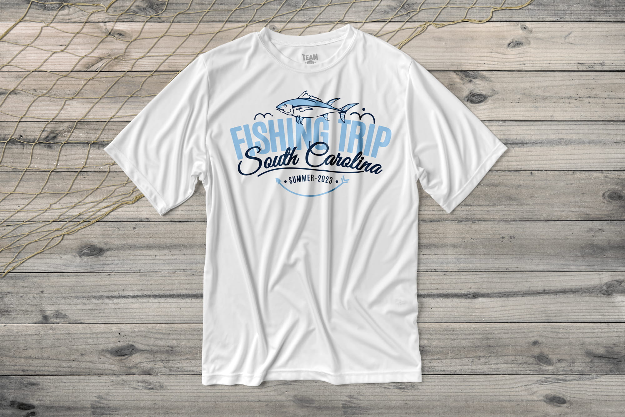 Custom performance t-shirt with a fishing themed template on the shirt. It says "Fishing Trip. South Carolina. Summer, 2023