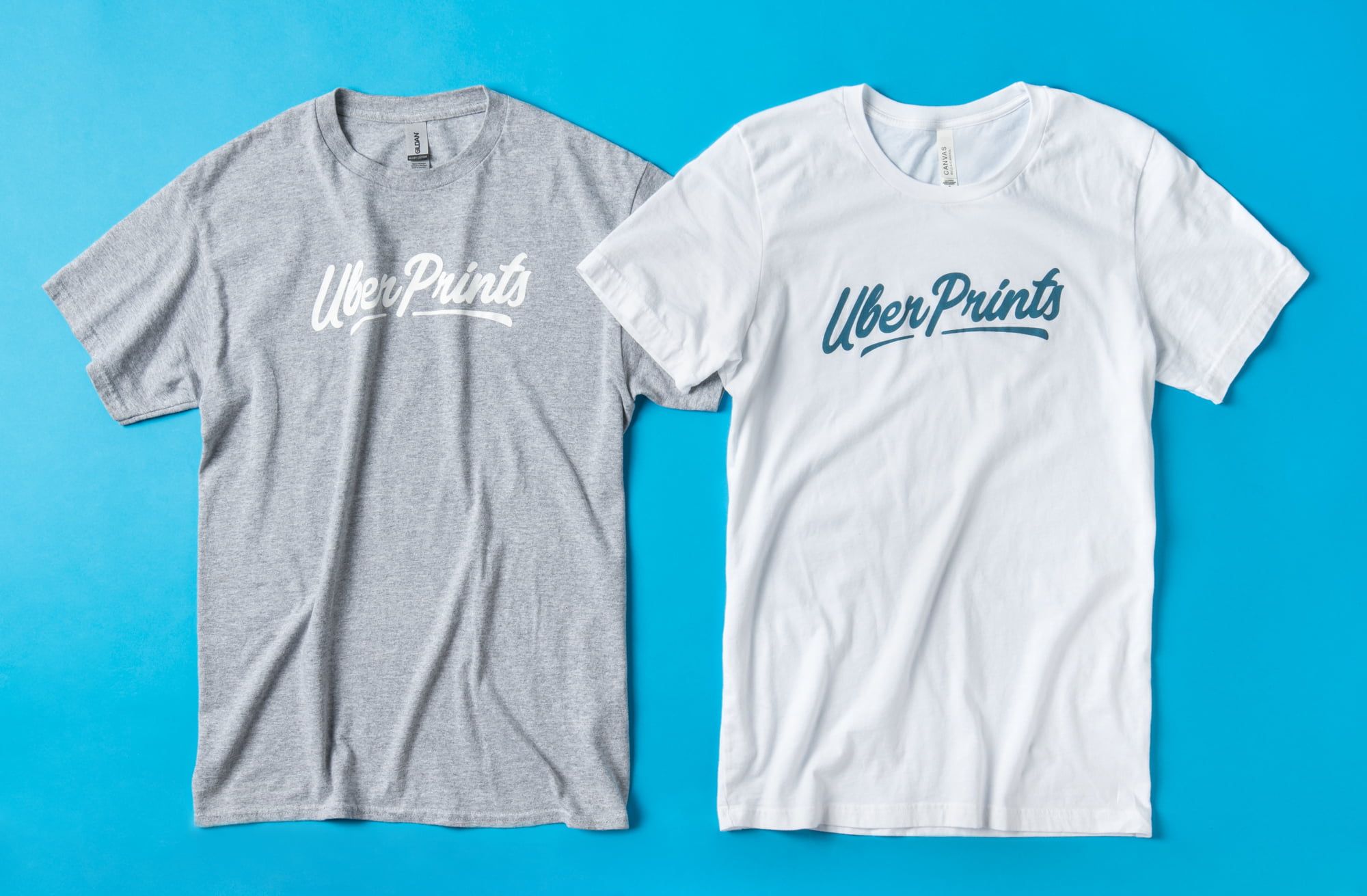 A flat top down image showing the Basic Tee and the Premium Tee