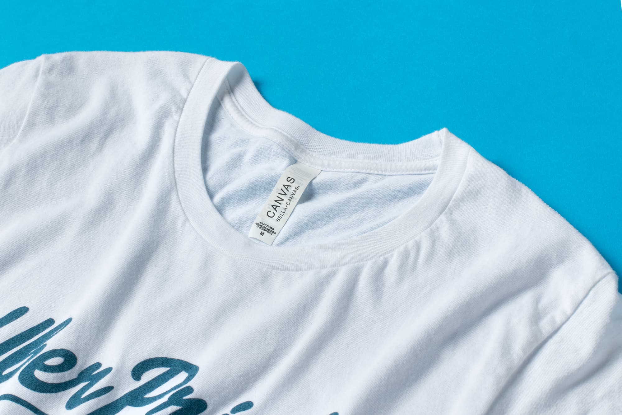 A detail view of the Premium Tee's collar and tag to show material