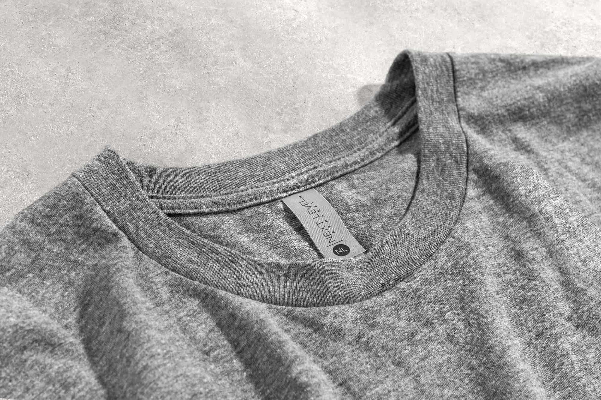 Detail closeup of the collar and tag of a next level t-shirt