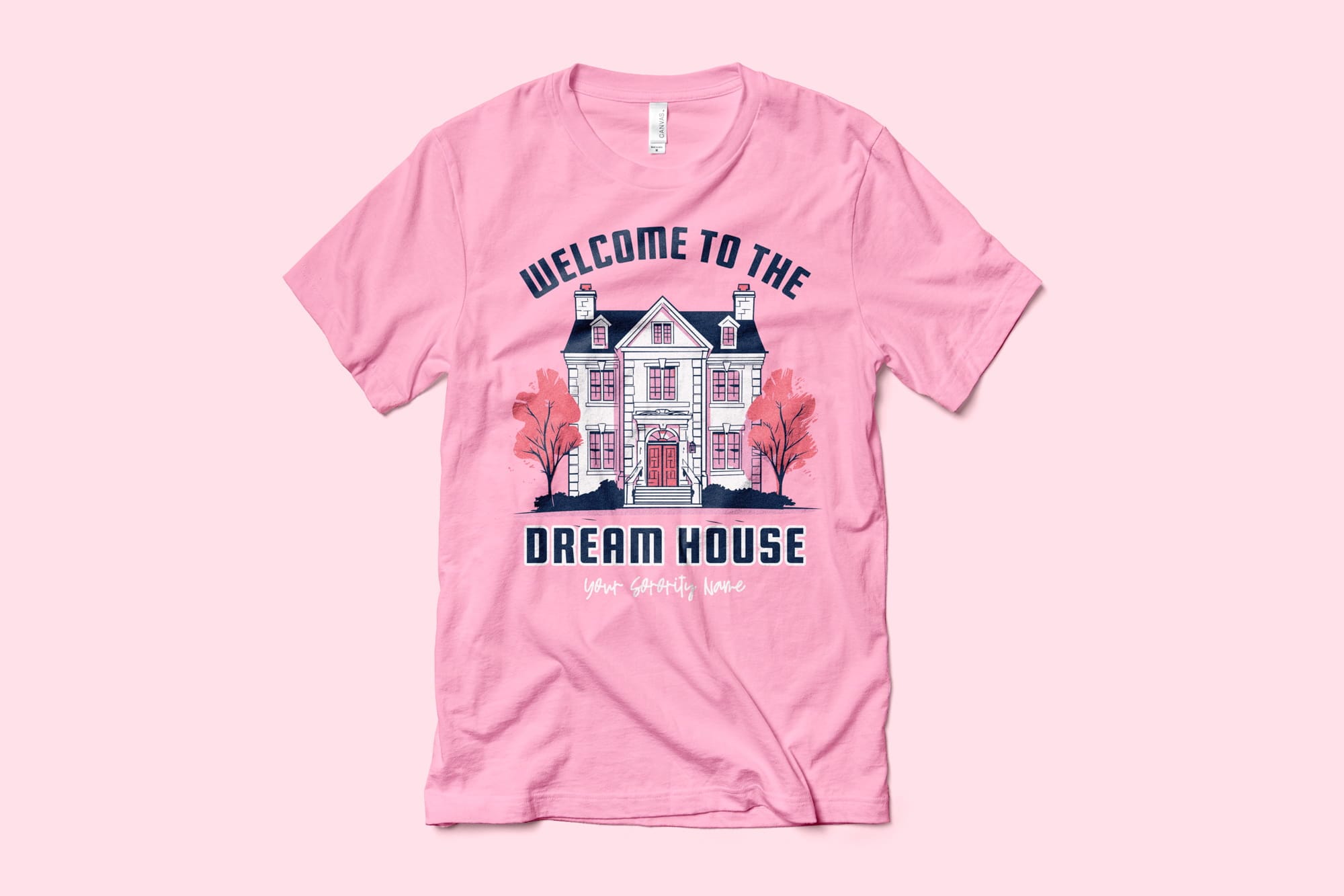 A pink tee that shows a sorority design that features a barbie inspired dream house.