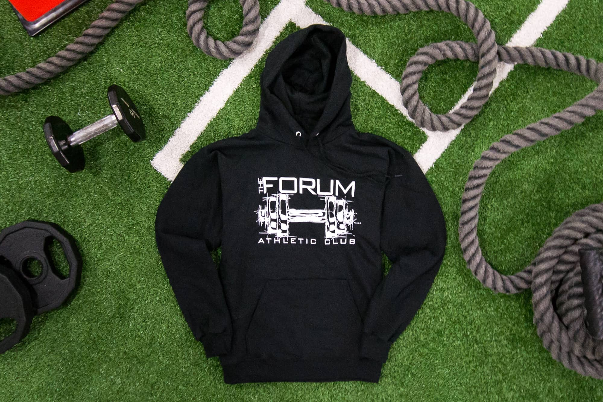 Flatlay of a hoodie for a gym brand