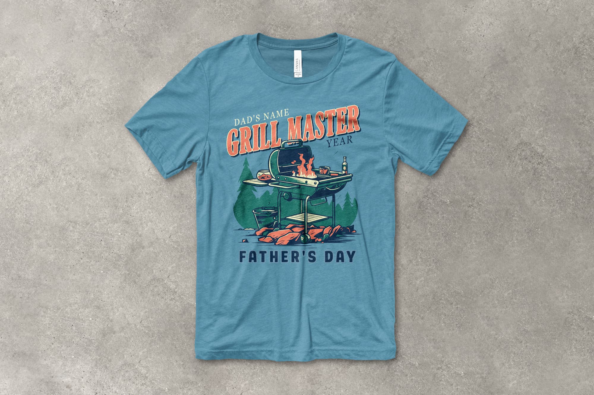 A flat t-shirt that has a customizable design that says "Grill Master - Father's Day" and features an illustration of a grill.