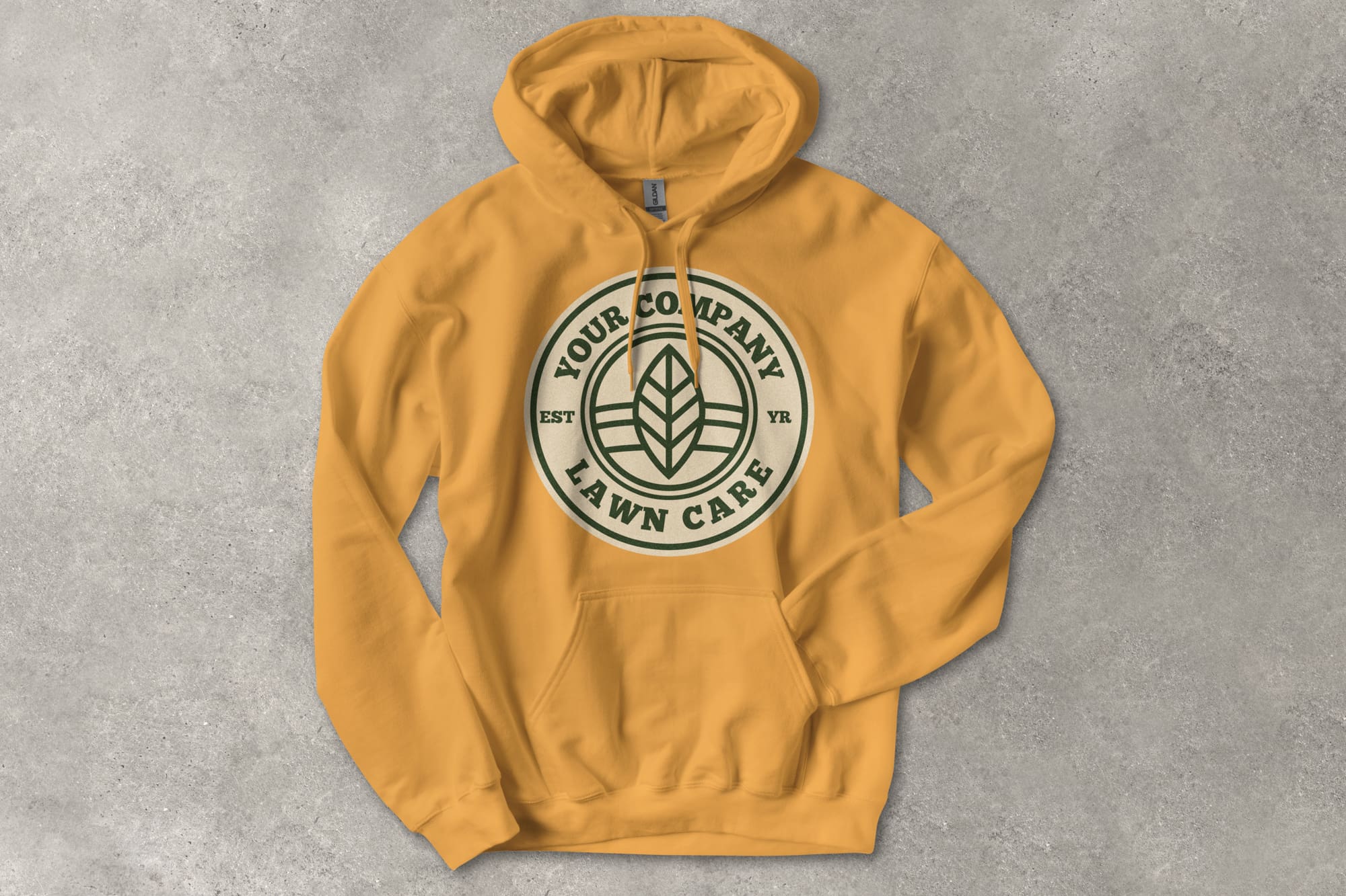 A flatlay image of the Gildan Softstyle hoodie with a customizable landscaping design.