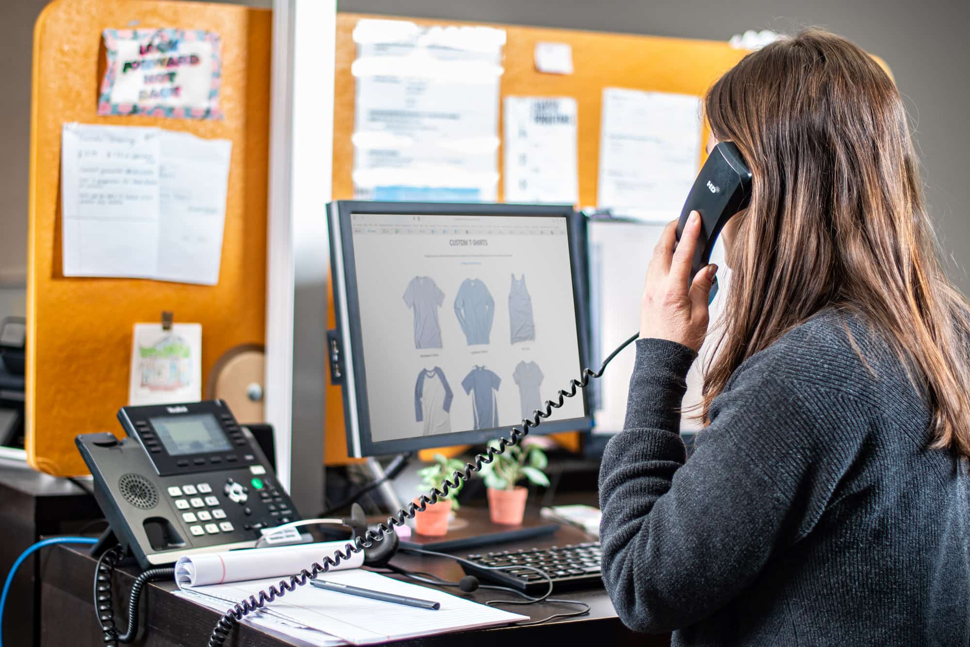 Image of a person in customer service on the phone helping with an order