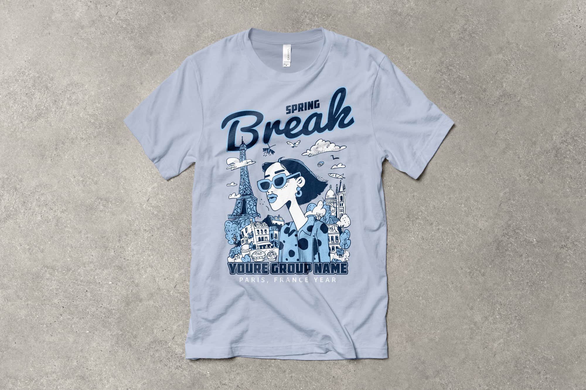 flatlay of a customizable travel themed spring break shirt with a graphic of a woman standing in front of the Eiffel Tower and city. text on shirt says spring break, your group name.