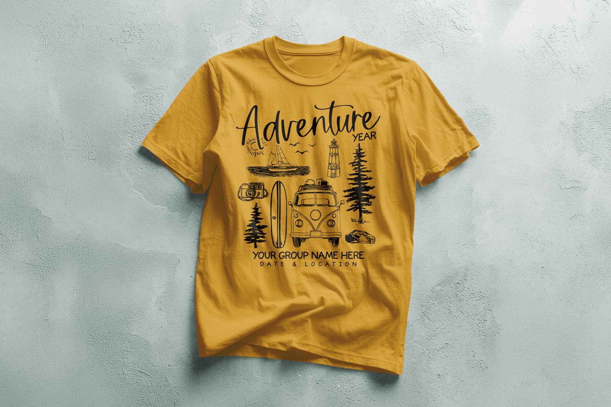 Yellow T-shirt with "Adventure Year" text. Features a camper van, surfboards, trees, birds, a sailboat, lighthouse, and car, conveying a travel vibe.